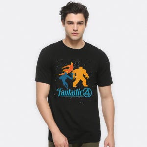 May include: Black t-shirt with a graphic of the Fantastic Four. The design features four colourful figures in orange, yellow, and blue, with the text "the Fantastic 4" in blue and white.