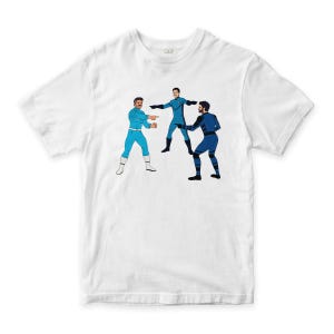 May include: White t-shirt with a cartoon illustration of three figures in blue and black outfits, pointing at each other. The figures have different hairstyles and facial hair. The design is a humorous meme.