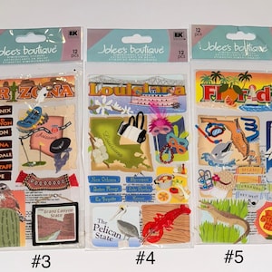 May include: Three sheets of stickers featuring state-themed designs. The first sheet features Arizona with landmarks and text including "Grand Canyon", "Phoenix", and "Tucson". The second sheet features Louisiana with landmarks and text including "New Orleans", "Shreveport", and "Baton Rouge". The third sheet features Florida with landmarks and text including "Tampa", "Miami", and "Key West".