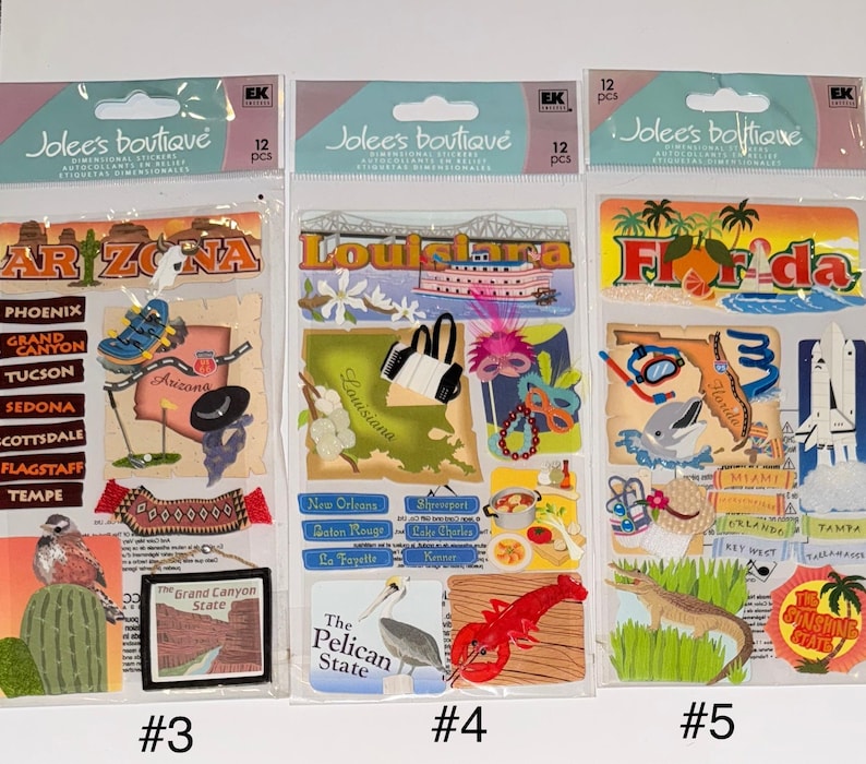 May include: Three sheets of stickers featuring state-themed designs. The first sheet features Arizona with landmarks and text including "Grand Canyon", "Phoenix", and "Tucson". The second sheet features Louisiana with landmarks and text including "New Orleans", "Shreveport", and "Baton Rouge". The third sheet features Florida with landmarks and text including "Tampa", "Miami", and "Key West".