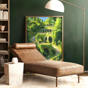 Framed digital artwork of the legendary Hanging Gardens of Babylon, featuring lush greenery and ancient architecture, leaning against a dark green wall in a cozy reading nook.