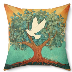 May include: A decorative cushion featuring a colourful illustration of a tree with a white dove flying out of it. The tree has green leaves and a brown trunk with roots. The background is a gradient of yellow, orange, and blue.