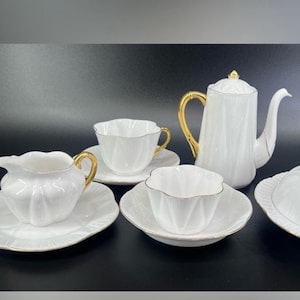 Shelley Regency Dainty Fine Bone China Tea or Coffee Set includes 9 pieces, white with gold accents. Vintage service crafted in England