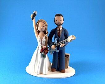 Custom singer and guitarist wedding cake topper