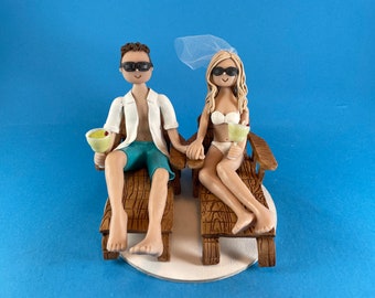 bride and groom in beach chairs wedding cake topper