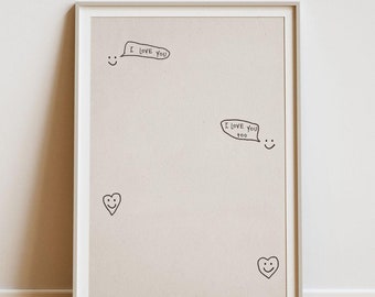 Può includere: Una stampa incorniciata con uno sfondo beige e disegni a inchiostro nero di cuori e facce sorridenti con il testo "Ti amo" e "Ti amo anch'io".