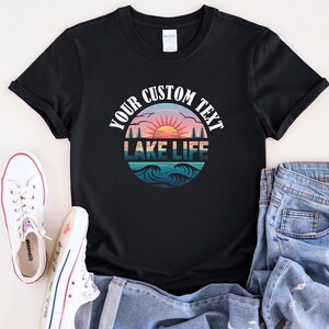 a black t - shirt with the words lake life printed on it