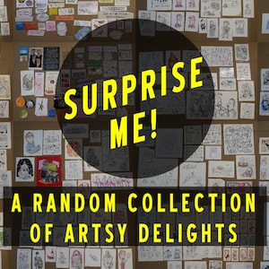 May include: A large brown board covered in numerous small, varied hand-drawn illustrations and sketches. A dark circular overlay features the yellow text SURPRISE ME! and a black rectangular banner displays A RANDOM COLLECTION OF ARTSY DELIGHTS.