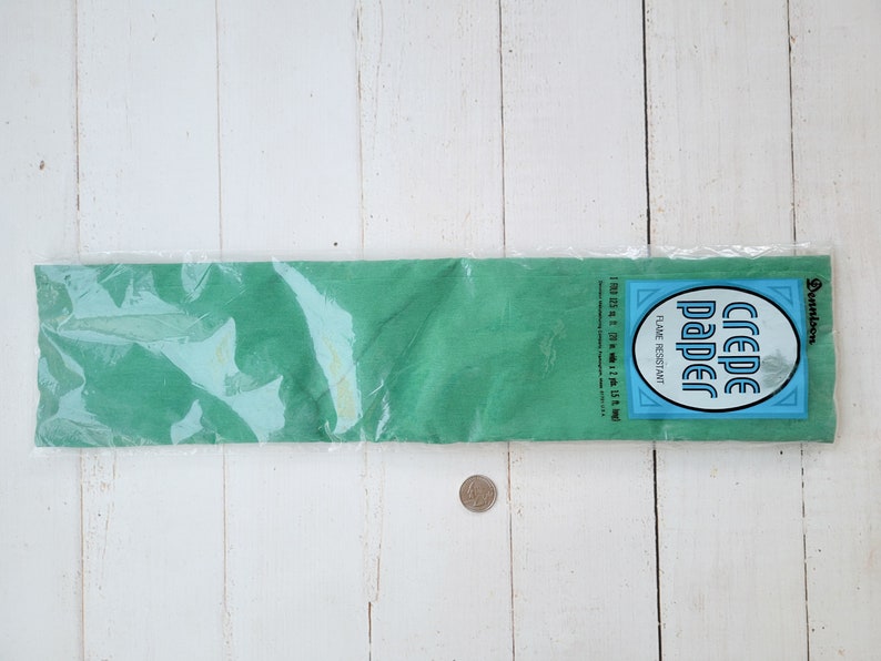 May include: A package of green crepe paper, 100 sq ft, flame resistant, by Dennison.