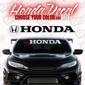 May include: A black car with a Honda decal on the windshield. The image features the Honda logo and the word "HONDA" in bold, white lettering. The text "Honda Decal" and "CHOOSE YOUR COLOR AND SIZE" are also visible.