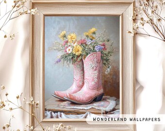May include: A framed painting of a bouquet of colourful flowers in pink cowboy boots. The boots are decorated with floral embroidery. The painting is set against a light blue background. The frame is a light wood colour. The text "WONDERLAND WALLPAPERS" is at the bottom of the image.