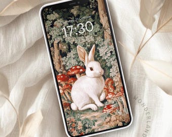 May include: A white rabbit with red eyes sits in a forest setting with mushrooms and green foliage. The phone screen displays the time 17:30 and the date Thursday, 31 October.