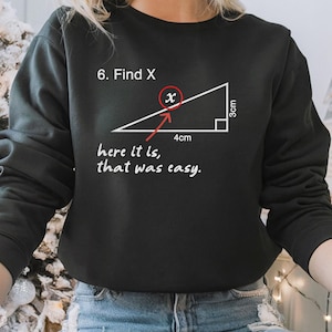 May include: Black sweatshirt with a white graphic of a right triangle with the text "6. Find X" and "here it is, that was easy." The triangle has a base of 4 cm and a height of 3 cm. The hypotenuse is labeled "x".
