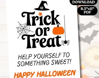 May include: A white Halloween-themed printable sign with the words "Trick or Treat" in black, along with a witch's hat, spiderweb, pumpkin, and spider. The sign also includes the phrases "Help Yourself to Something Sweet!" and "Happy Halloween" in orange.