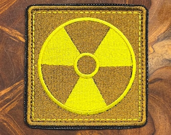Parche Loner - 8,5 x 8,5 cm / 3,4 × 3,4 pulgadas. Insignia bordada de facción inspirada en STALKER. Se adhiere con plancha y cierre de velcro. Ideal para regalar a gamers o para completar tu uniforme o mochila.