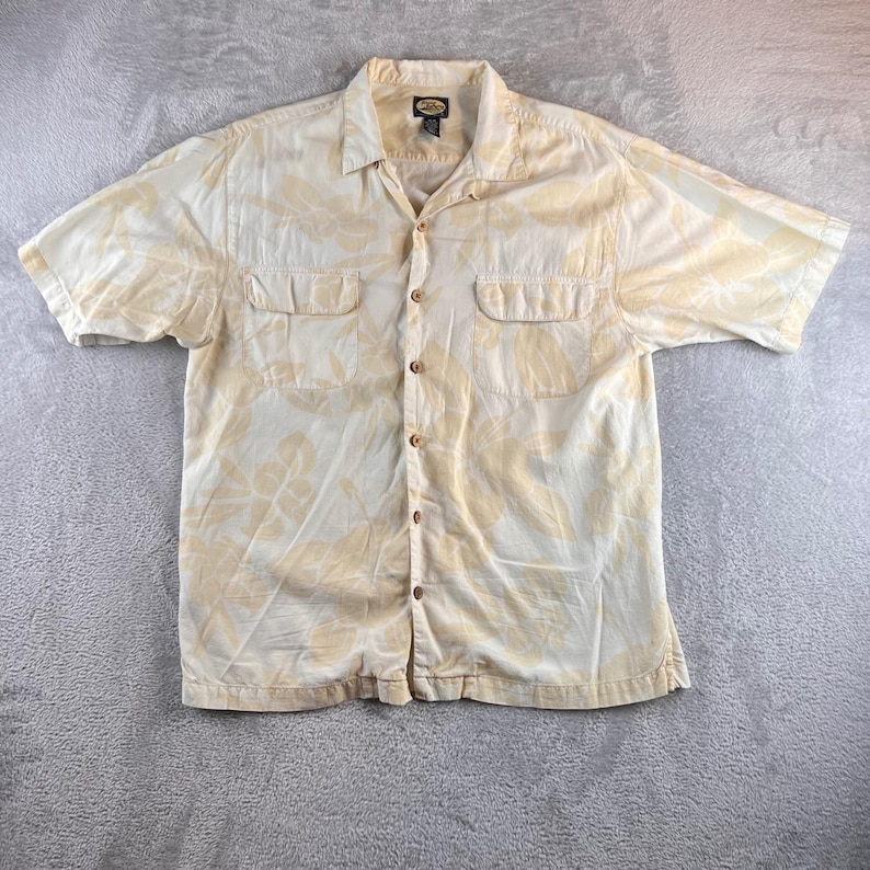 Camisa vintage Tommy Bahama para hombre, talla M, con estampado floral tropical, color crema y amarillo. LEER imagen 1