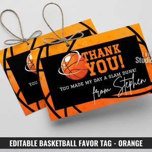 May include: Two orange basketball-themed gift tags with the text "THANK YOU!" and "YOU MADE MY DAY A SLAM DUNK!" The tags feature a basketball graphic and are tied with twine. The text "from Stephen" is also included.