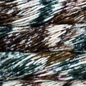 May include: Close-up of thick, textured yarn in shades of brown, white, green, and pink. The yarn appears to be hand-dyed, with a variegated color pattern. The fibers are thick and chunky, ideal for knitting or crocheting projects.