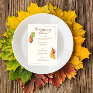 May include: A Thanksgiving dinner menu with a watercolor illustration of fall leaves. The menu includes starters, main course, sides, and dessert. The text reads "Thanksgiving Dinner".