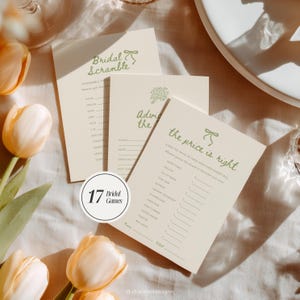 May include: Three ivory bridal shower game cards with green text and bow illustrations. Games include "Bridal Scramble", "Advice for the Bride", and "The Price is Right". A circular sticker reads "17 Bridal Games".