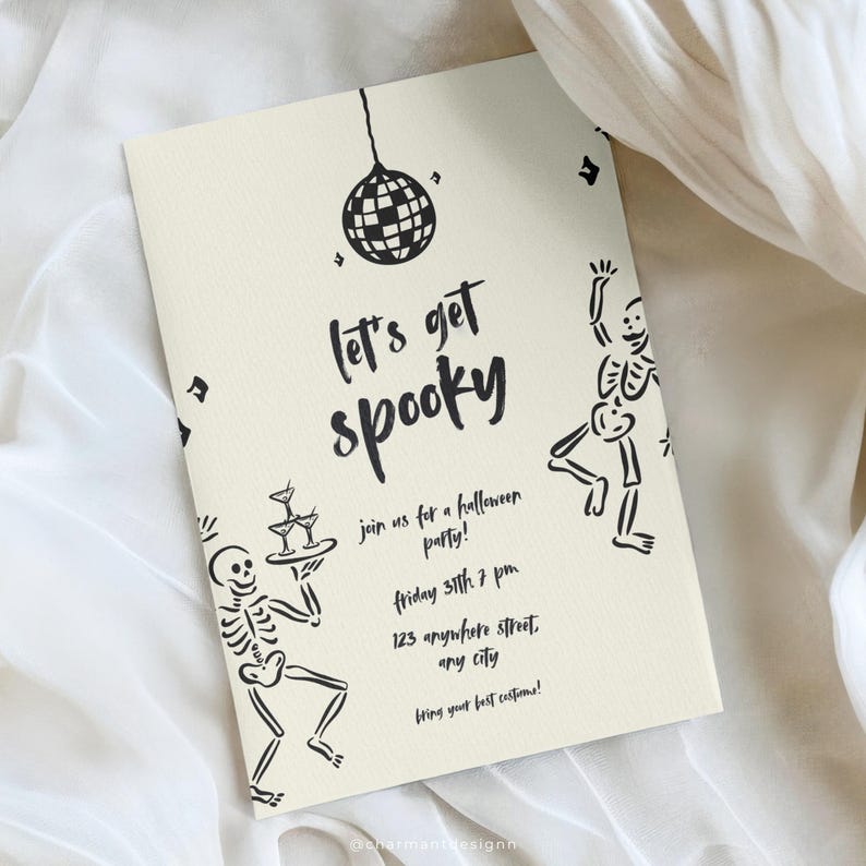May include: Cream-colored Halloween party invitation with black text and illustrations. The invitation reads "Let's get spooky" and includes skeleton figures, a disco ball, and party details. The invitation is rectangular.