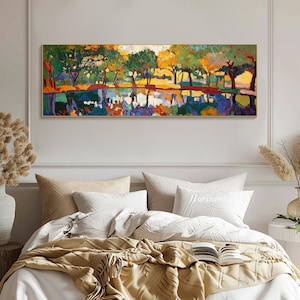 May include: A colorful abstract painting of a landscape with trees reflected in a still body of water. The painting is done in a vibrant palette of blues, greens, yellows, and oranges.