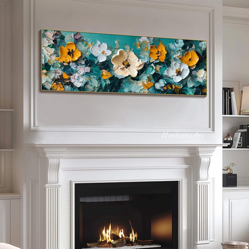 May include: Abstract painting of yellow and white flowers on a teal background. The painting is framed and hanging on a white wall above a fireplace.