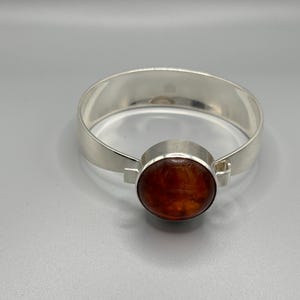 Niels Erik From Danish Silver Amber Torque Bangle. 1950’s Modernist Cabachon Amber Jewel and Sterling Silver 32.6g