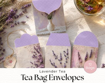 May include: Three decorative paper envelopes for tea bags featuring lavender floral prints and light purple patterned flaps. The envelopes display imagery of lavender sprigs and a small vase. A pink circular label indicates 12 Bags.