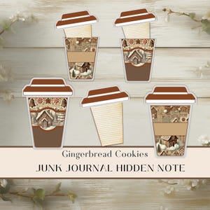 May include: Paper cutouts in the shape of coffee cups, decorated with gingerbread house motifs. Each cup has a brown lid and a space for notes. The text reads "Gingerbread Cookies JUNK JOURNAL HIDDEN NOTE."
