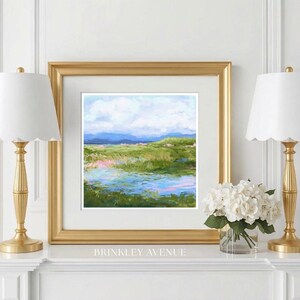 Contemporary low country marsh abstract canvas print featuring southern wetland landscape with soft blue sky, green marsh grasses, reflective water, coastal Grandmillennial home decor wall art in gold frame