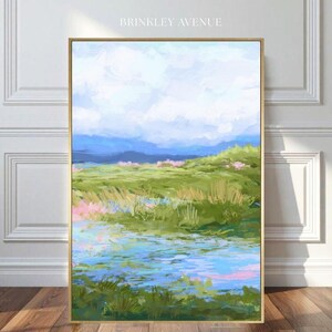 Contemporary low country marsh abstract canvas print featuring southern wetland landscape with soft blue sky, green marsh grasses, reflective water, coastal Grandmillennial home decor wall art in gold frame