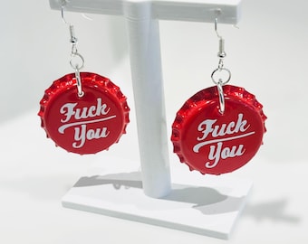 Subversive Fuck You Earrings in a vintage Cola bottle cap style