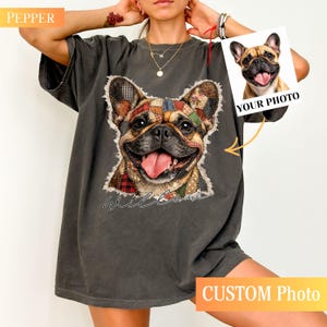 May include: Dark gray t-shirt featuring a smiling French Bulldog with a patchwork design. The dog's image is surrounded by a stitched border, with the word "Wild Love" in cursive below. A small photo with the text "YOUR PHOTO" is also visible.