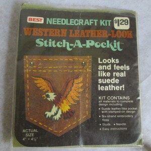 May include: A craft kit to make a Western-style leather-look pocket with an eagle design. The kit includes suede leather-like fabric, embroidery floss, studs, a needle, and easy instructions. The finished pocket measures 4 inches by 4 1/2 inches.
