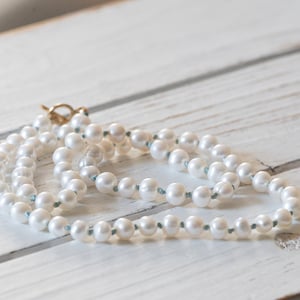 Classic White Freshwater Pearl   knotted by hand on silk in aqua color