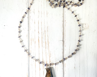 Long iolite necklace with rustic kyanite drop