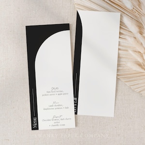 May include: Two minimalist menu cards with a black and white design. One card displays a menu with text, including "Stats", "Main", and "Dessert". The other card is blank. The cards are on a neutral linen surface.