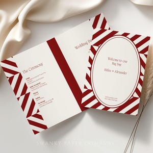 May include: Wedding stationery set featuring a cream background with burgundy accents. The design includes a geometric pattern and text that reads "Welcome to our Big Day" and "The Ceremony". The stationery is from Swanky Paper Company.