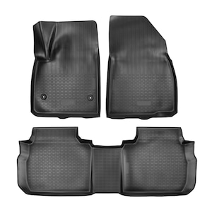 May include: A set of four black rubber car floor mats. The mats have a textured surface with a grid pattern and raised edges. Two mats are designed for the front, and two are for the rear. The front mats have a molded design to fit the footwells.