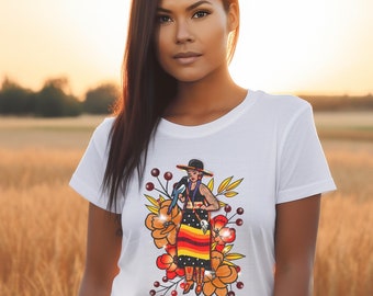 May include: White t-shirt with a colorful graphic print of a woman wearing a hat and a long skirt with floral accents. The woman is holding a bird in her hand.