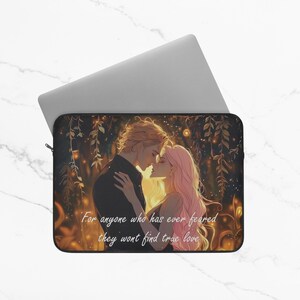 May include: Laptop sleeve featuring an illustration of a couple embracing, with the text "For anyone who has ever feared they won't find true love." The artwork depicts a man and woman in a romantic setting with a warm color palette.