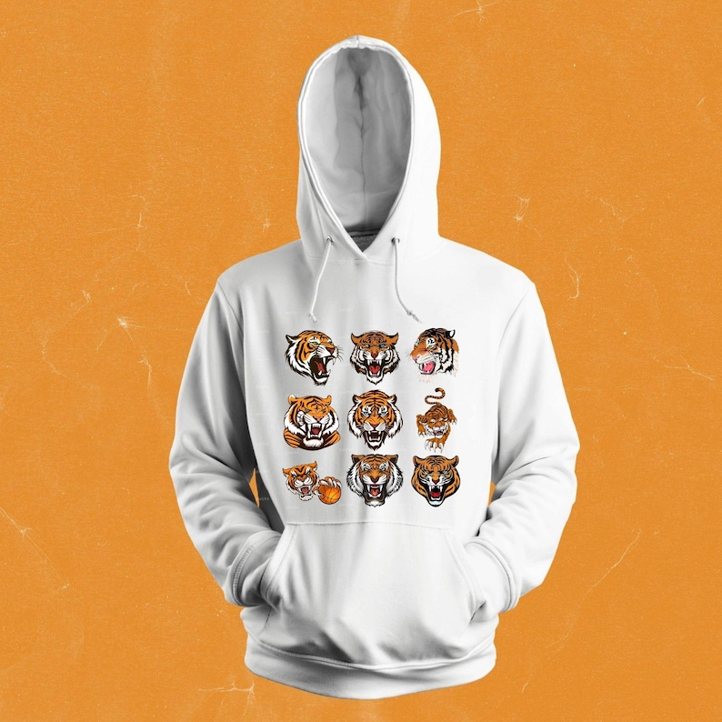 May include: White hooded sweatshirt with a graphic print of multiple tiger faces and a basketball.