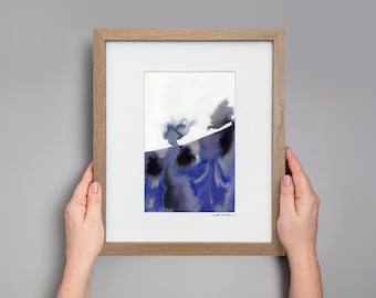 May include: A framed abstract watercolor painting in shades of blue and black. The painting depicts a landscape with two trees and a hill. The artist's signature is visible in the bottom right corner.