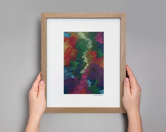 May include: A framed abstract art print with a colorful, textured design in shades of red, green, blue, purple, and yellow. The print is framed in a light brown wood frame.