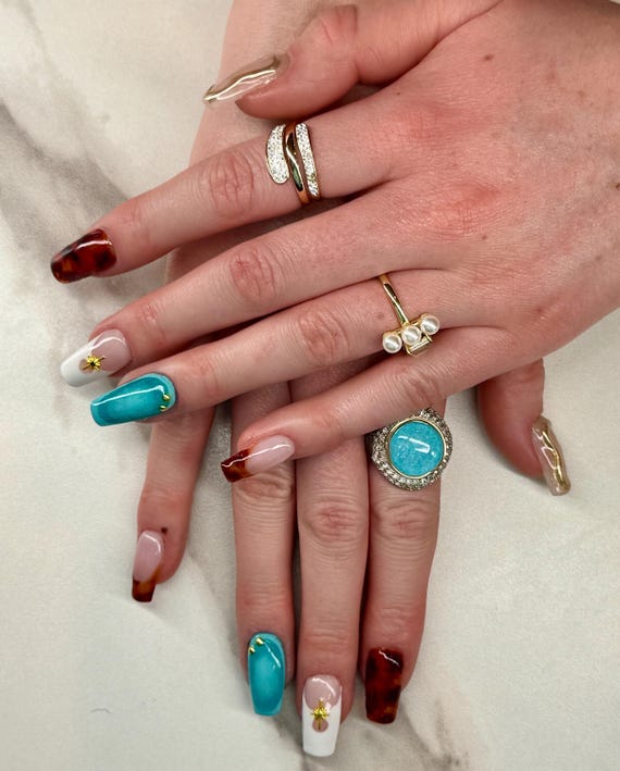 Custom, high quality, reusable press-on nails made with only the best nail products on the market!