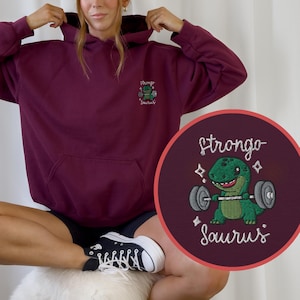 Strongosaurus Stickerei Hoodie oversize Niedlicher Dino im Gym | Pullover Pulli  | Lustige Fitness Kleidung Unisex pump cover | Dinosaur