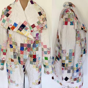 May include: A white quilted coat with a patchwork design. The coat features a large collar and is covered in small, colorful squares of fabric. The patchwork includes various patterns and colors, creating a unique and vintage aesthetic.