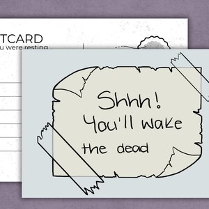 May include: A postcard with the text "POSTCARD wish you were resting" on the left. The right side features a light blue card with a torn paper design and the words "Shhh! You'll wake the dead" in black. The torn paper is taped to the card.