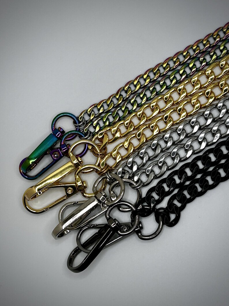 May include: Five different chain styles with lobster clasps. The chains are black, silver, gold, and iridescent.